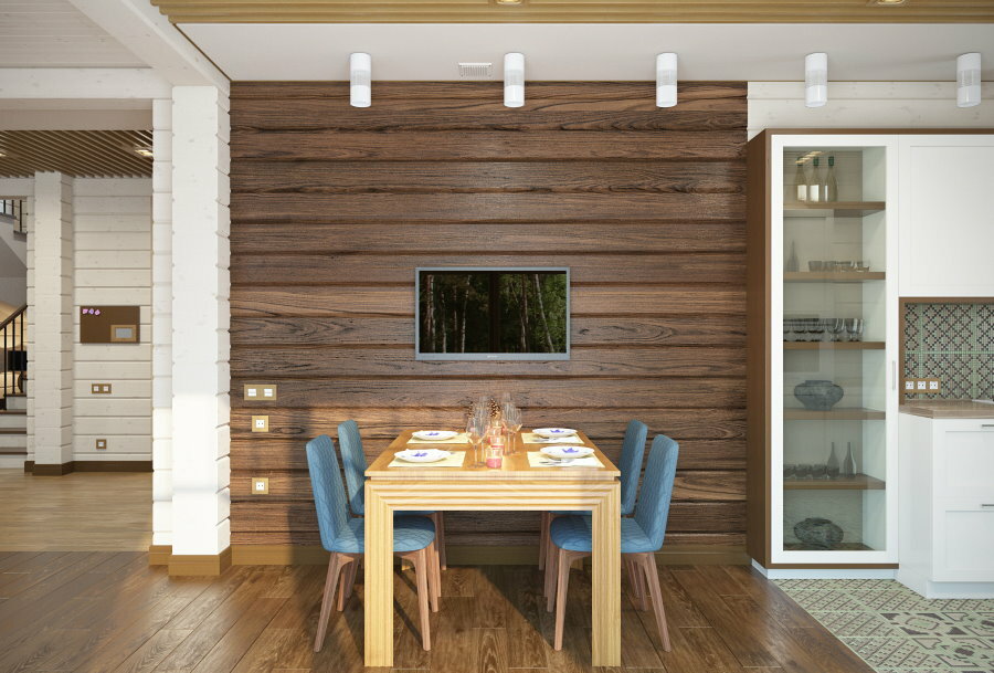 Akcentinės sienos apdaila medinio namo virtuvėje-svetainėje