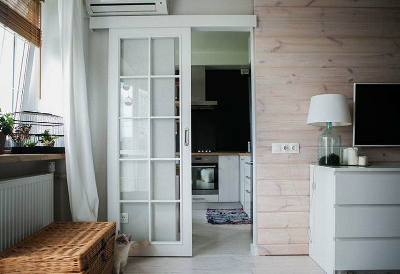 Sliding door with glass on a wooden frame