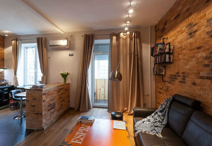 Área de lazer de um apartamento estúdio em estilo loft