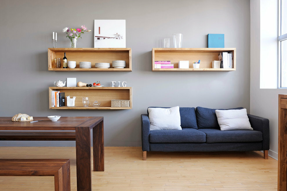 Rectangular shelves on the gray wall of the living room