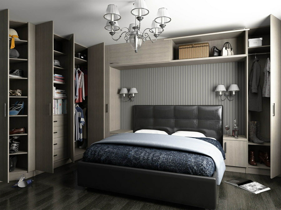 Open doors of gray wardrobes in the bedroom