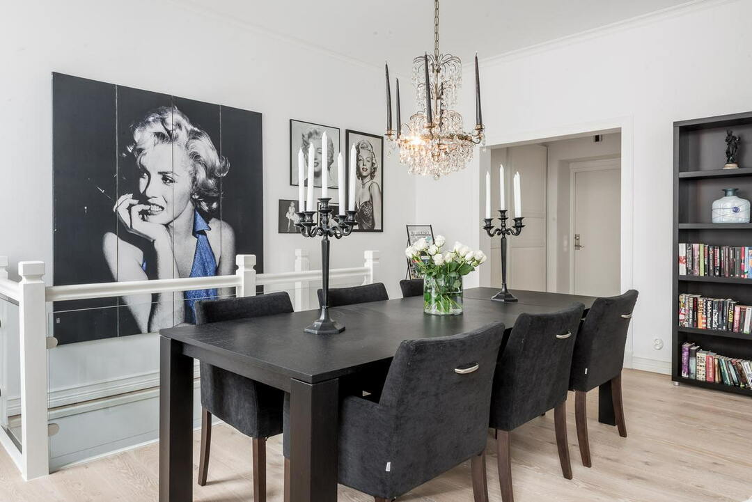 Black dining table in the hall with a picture