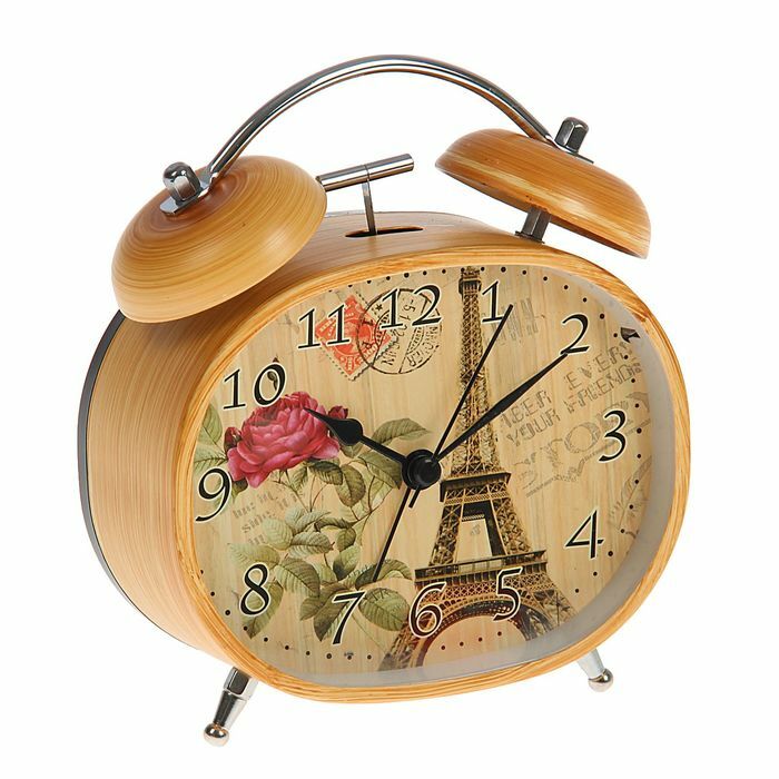 Alarm clock oval, antique brown, on the dial of the Eiffel Tower