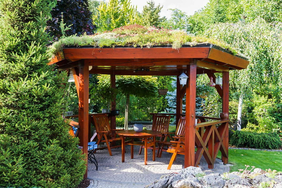 Wooden gazebo with grass roof