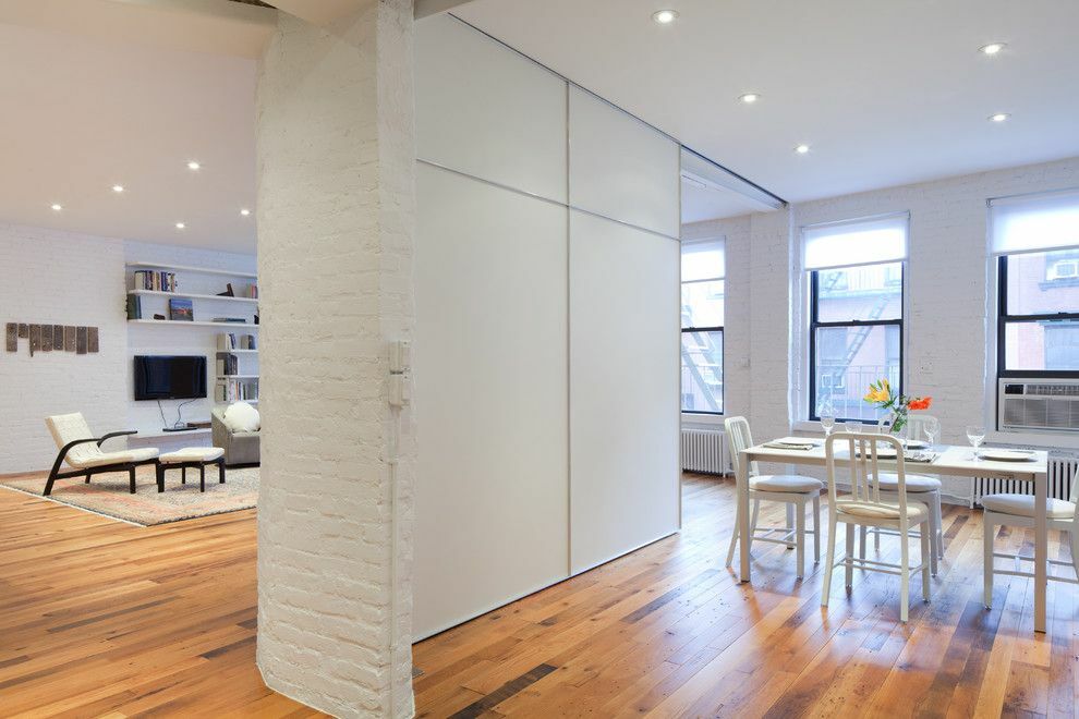 White partition in the kitchen-living room