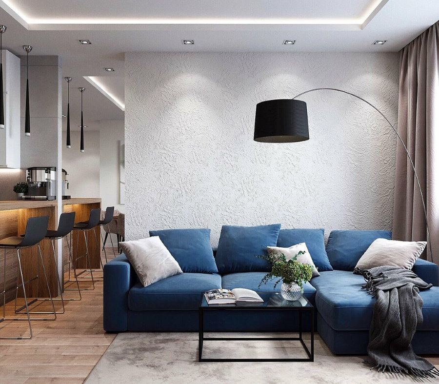 Lighting in the living room with a blue sofa