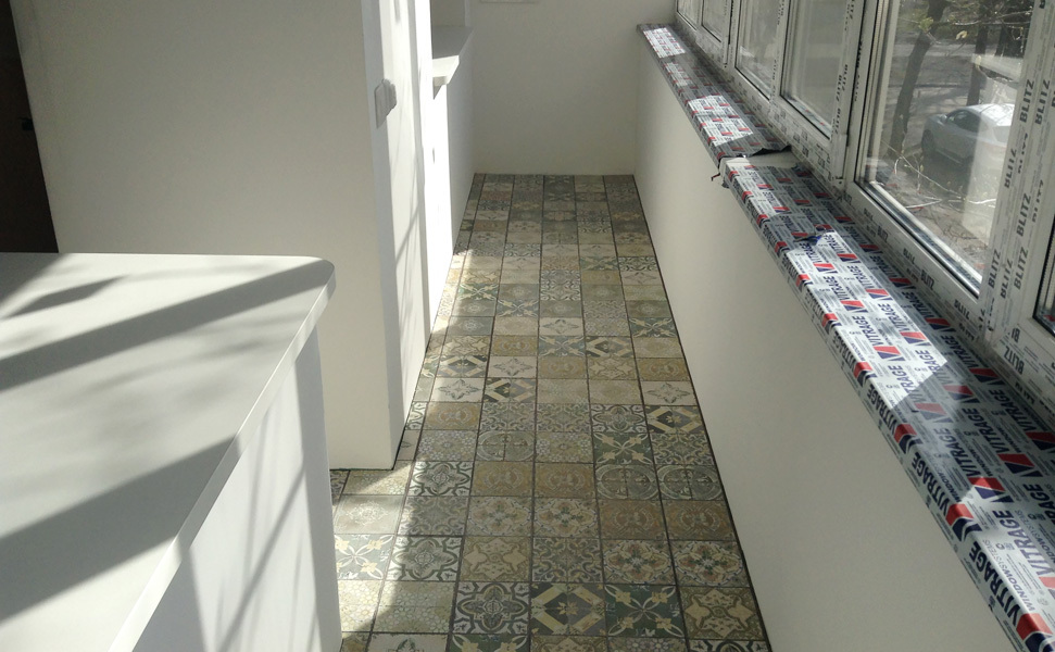 Patchwork tiles on the floor of the loggia