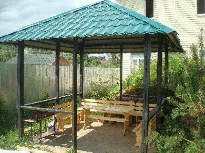 Square gazebo on a frame made of shaped pipes