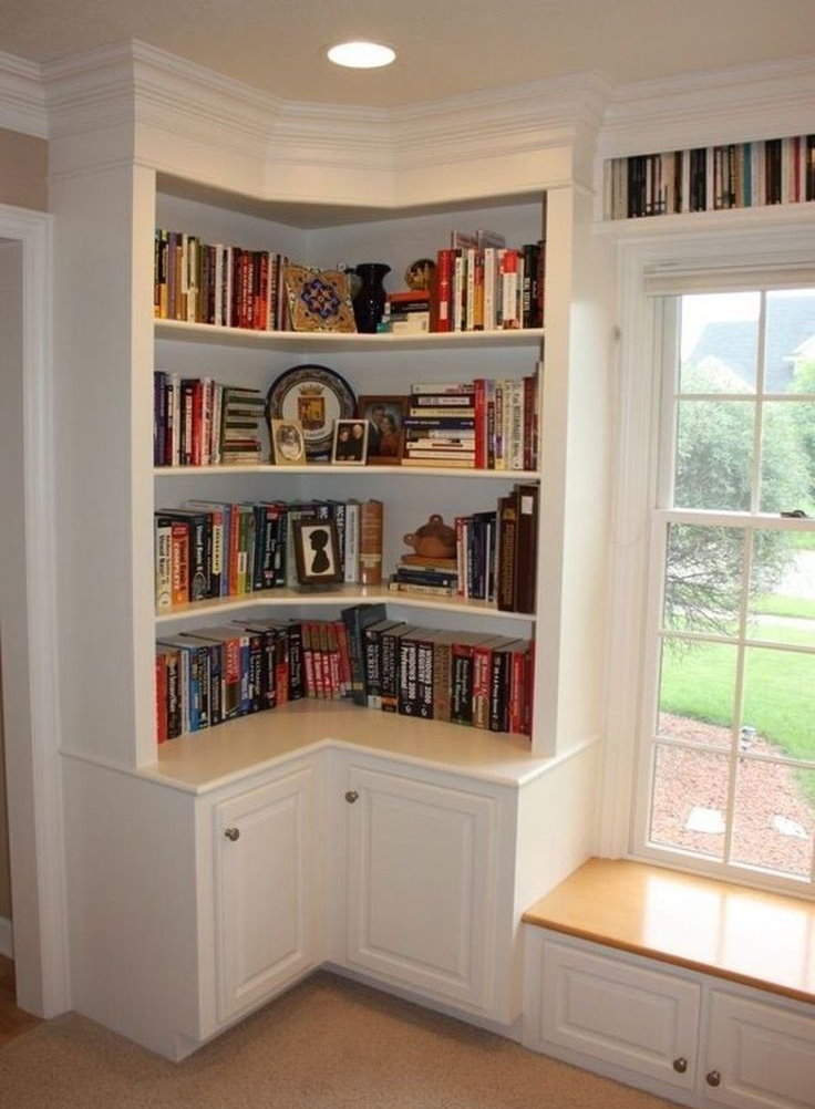Books on shelves built into the corner of the room
