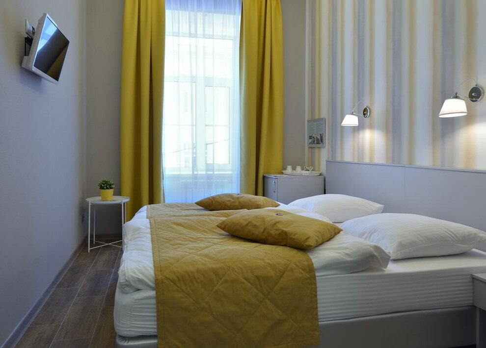 Small yellow curtains in the bedroom
