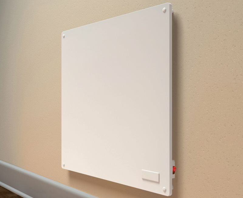 Panel convector on a beige wall