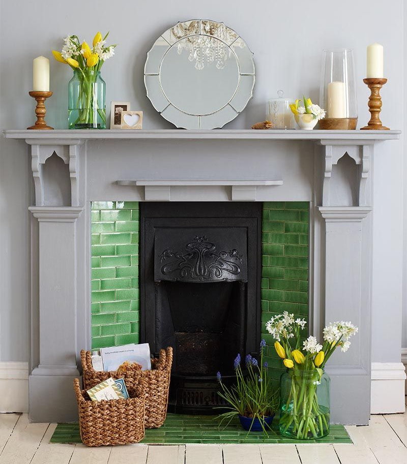 Cast iron firebox in the portal of a decorative fireplace