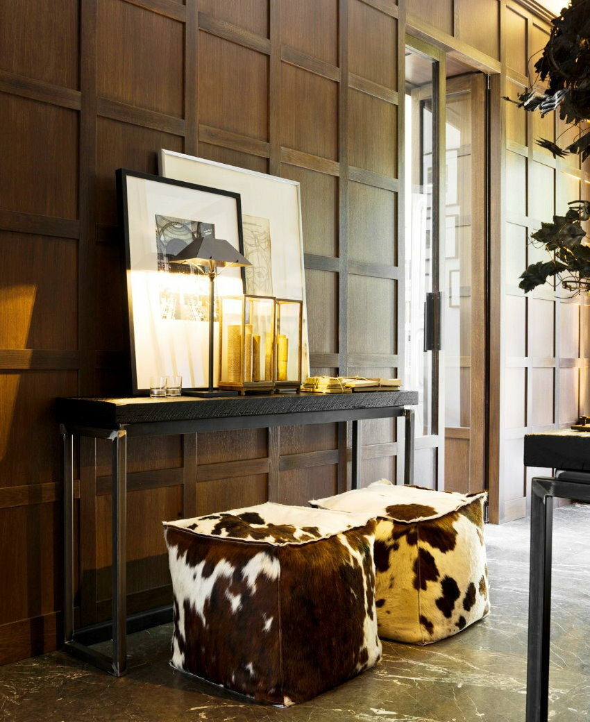 Stylish poufs in the hallway of a country house