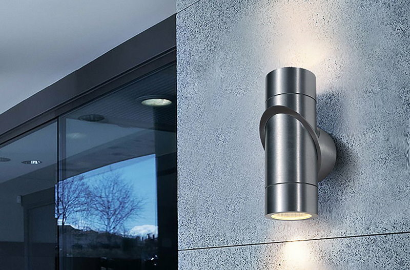 Directional luminaire on a gray building wall