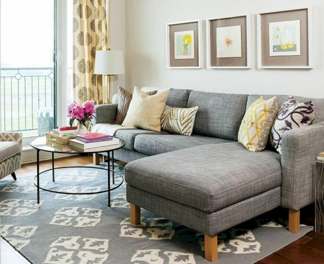 Gray corner sofa on wooden legs