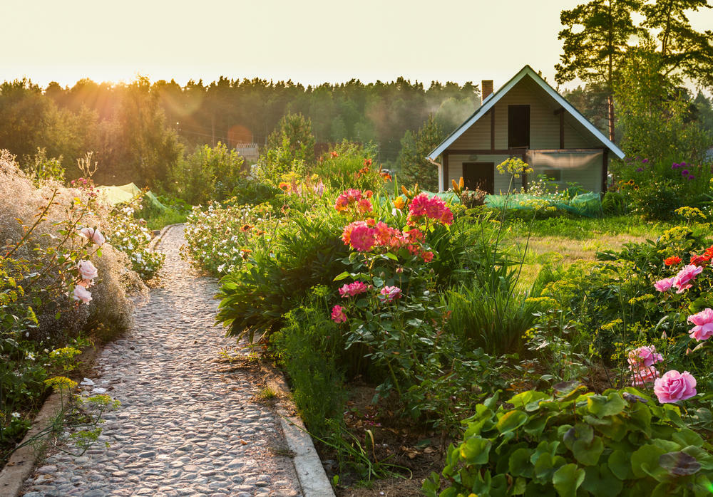 Straight path made of fine stone in a beautiful summer cottage