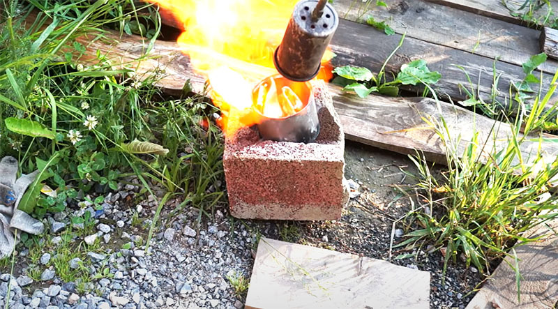 Aluminum is melted in a tin can with a propane torch