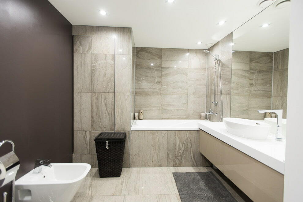 Large format tiles on the bathroom wall
