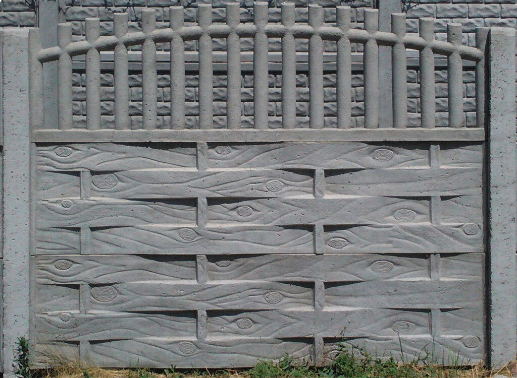 Grijze textuur van een gedeelte van een gewapend betonnen hek