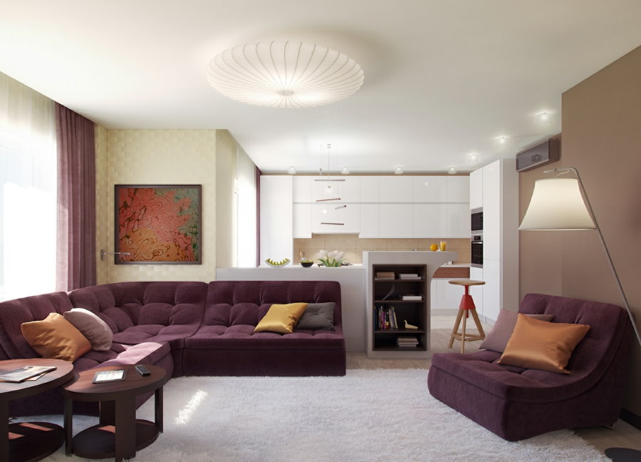 Telpa purpursarkanām mēbelēm studijas tipa dzīvoklī