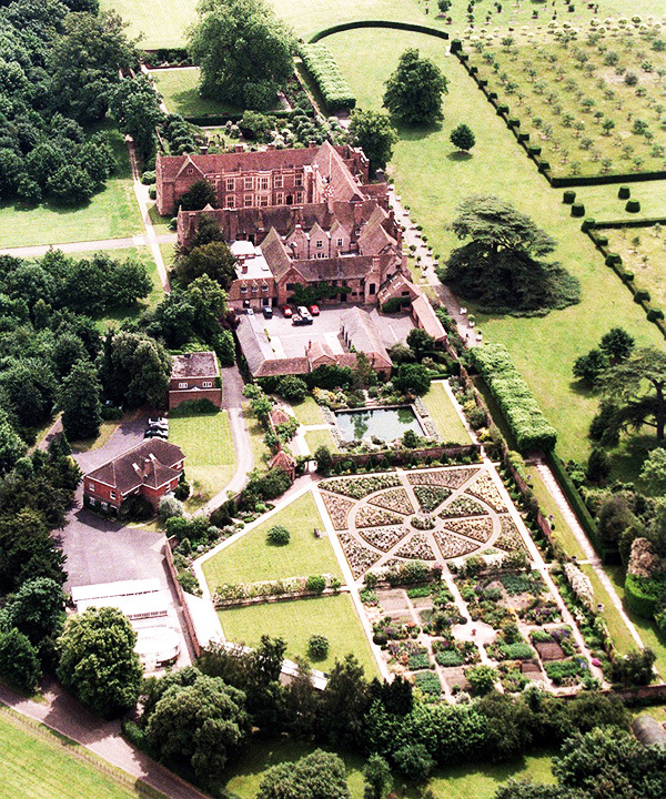 The estate is surrounded by a well-groomed forested area