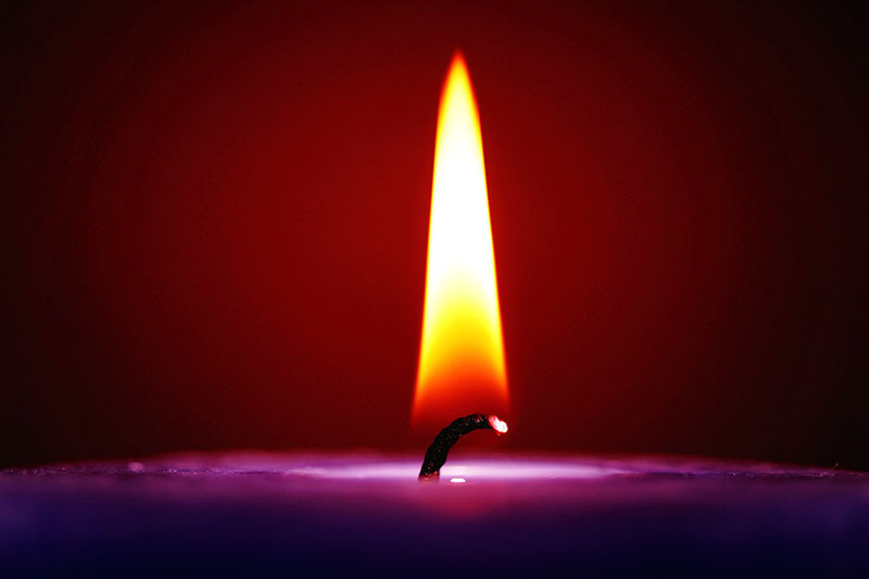 An ordinary candle practically does not emit soot when burning