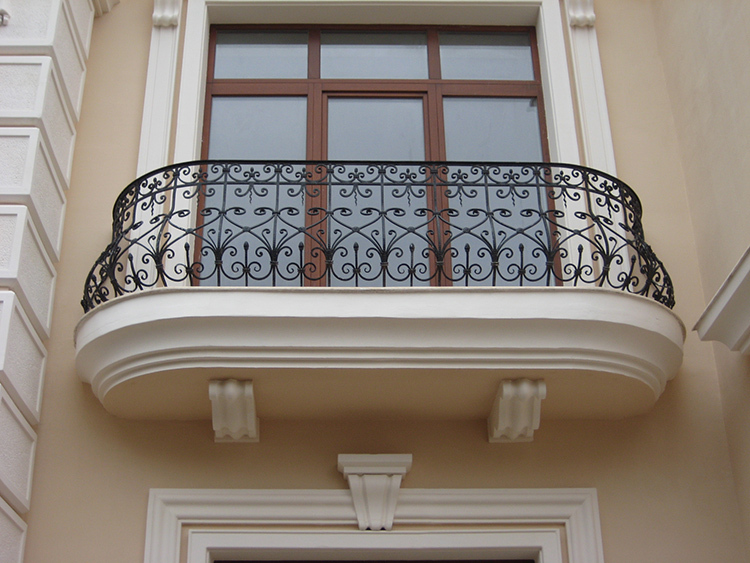 Uniqueness is evident in the details: wrought iron railings inside and outside the house