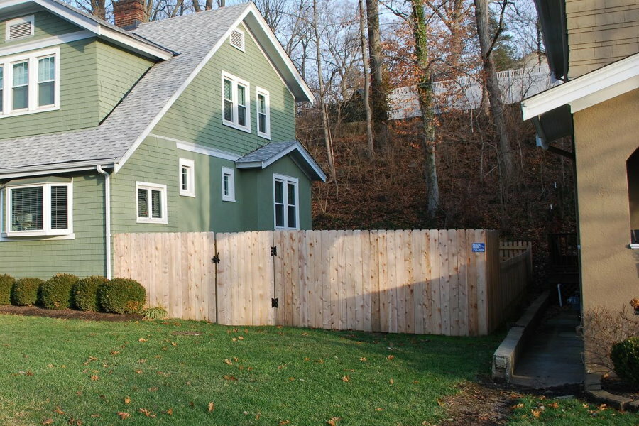 Wooden fence between neighboring houses