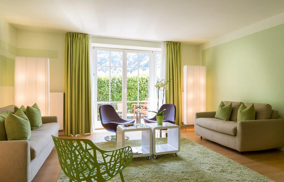 living room in green design photo