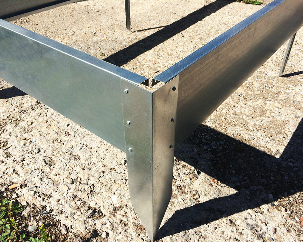 Corner of a metal bed with self-tapping screws
