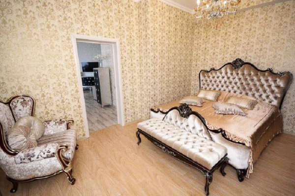 One of the most luxurious rooms is the bedroom. There is nothing superfluous in it - only a bed, an armchair and a footstool