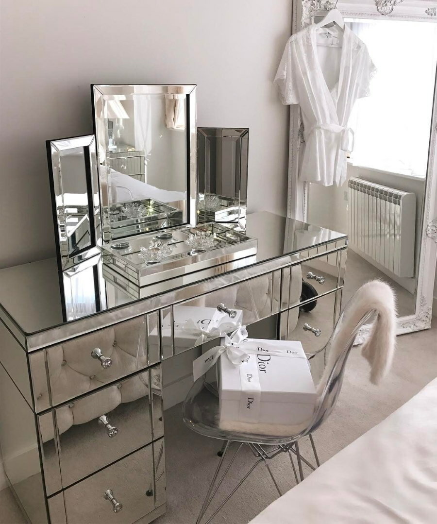Mirrored chest of drawers in a small room