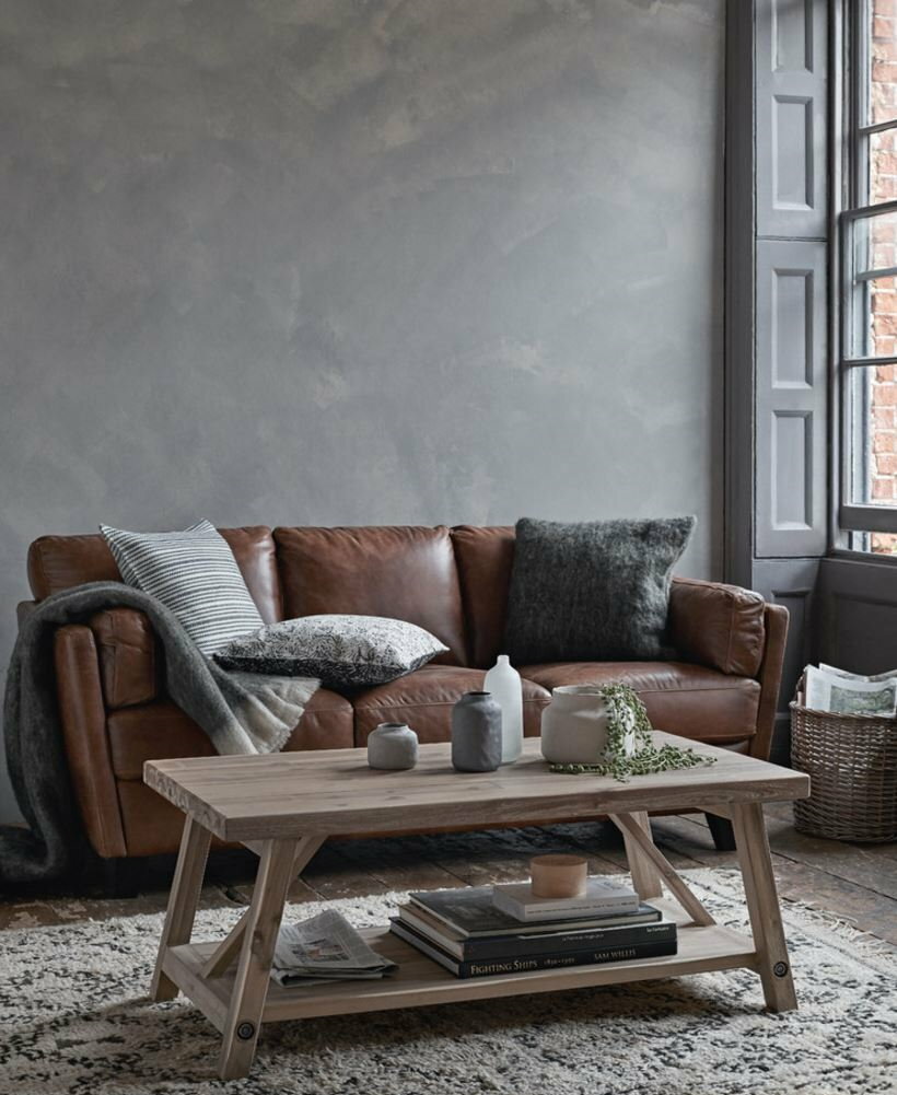 Brown sofa against a gray wall