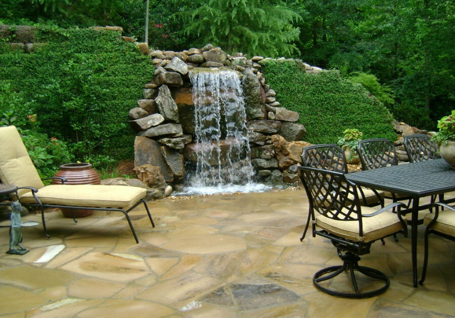 Waterfall in the recreation area of ​​the garden plot