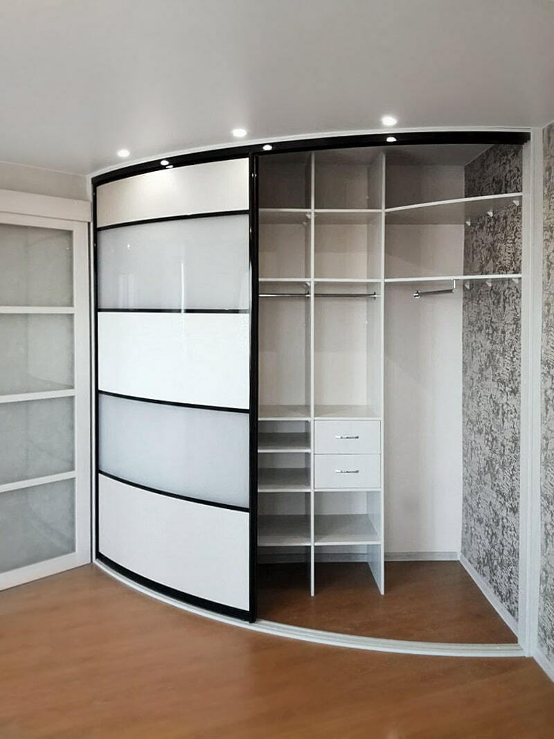 Shelves inside corner cabinet of radius type