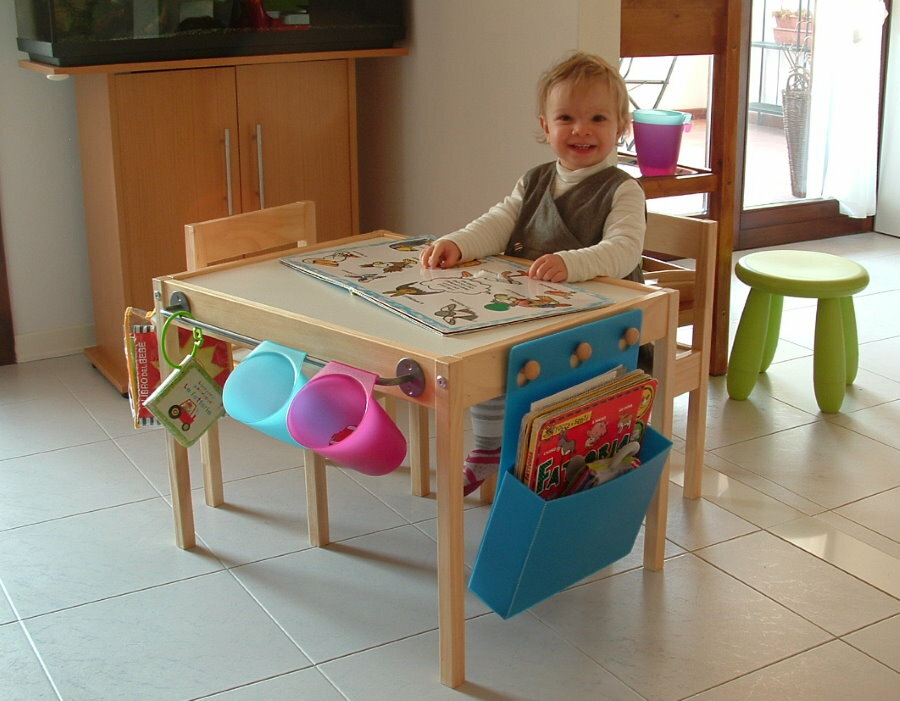 Little child at the table for children's games
