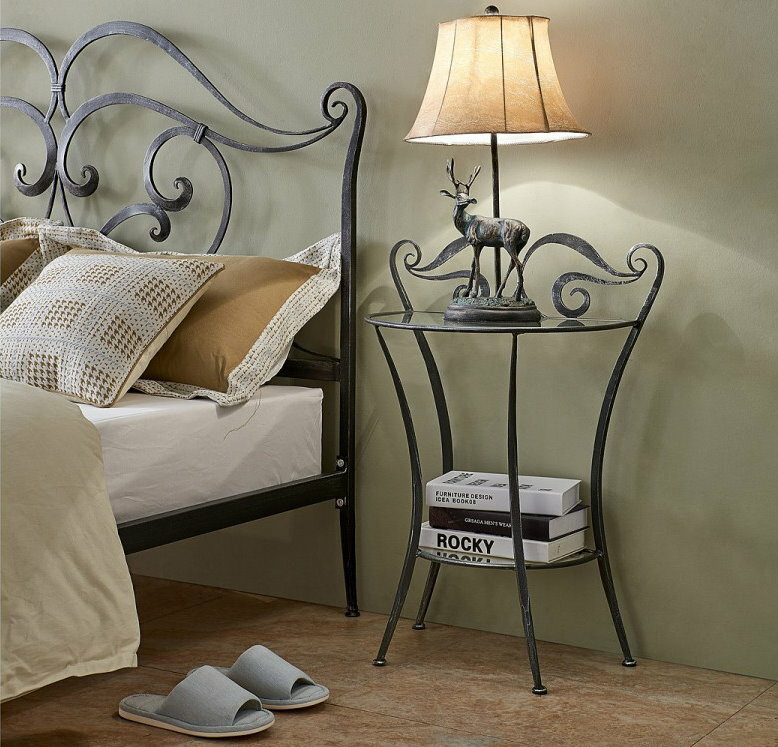 Bedroom interior with wrought iron bedside table