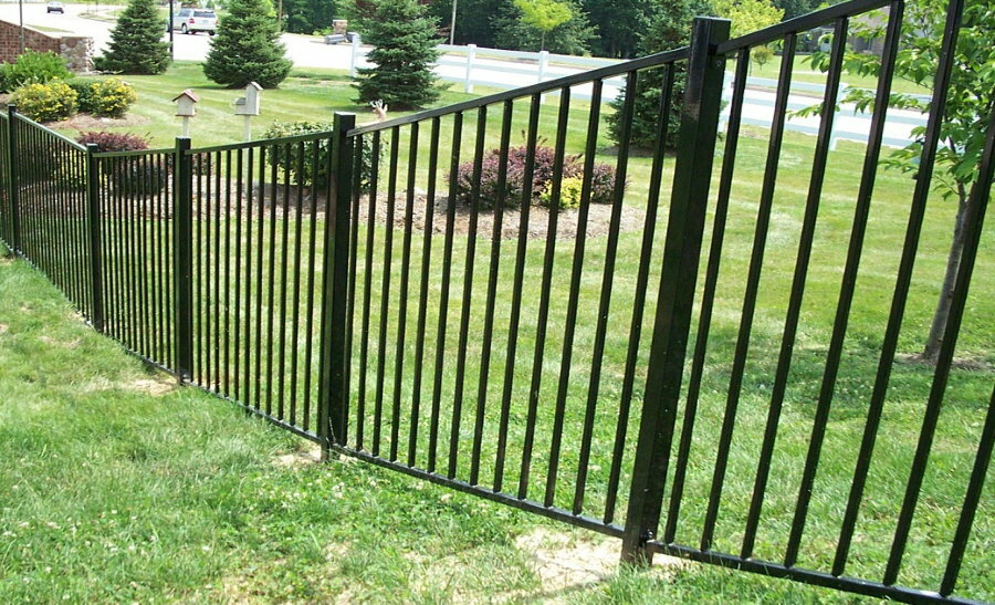Metal fence on a site with a slope