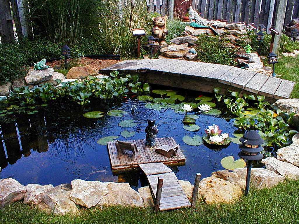 Wooden bridge over a small pond