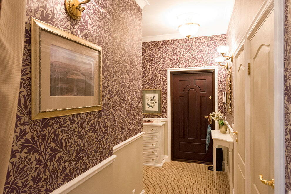 Pasting the walls of the corridor with vinyl wallpaper