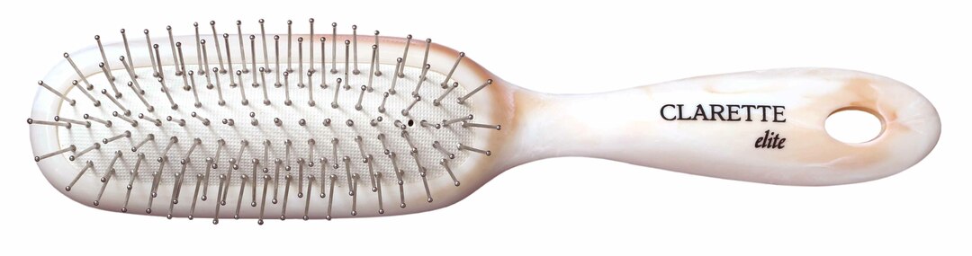 CLARETTE hair brush on a pillow with metal teeth, universal