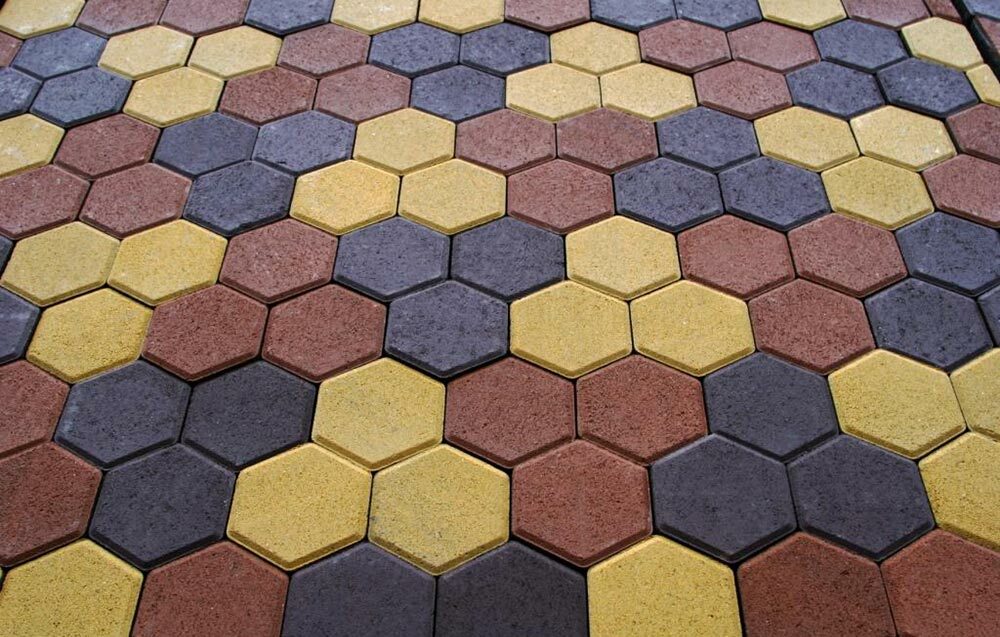 Multicolored honeycomb tiles in the courtyard of the cottage