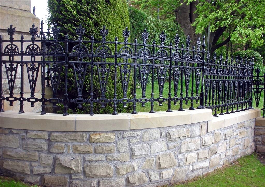 Stone foundations with forged fence sections
