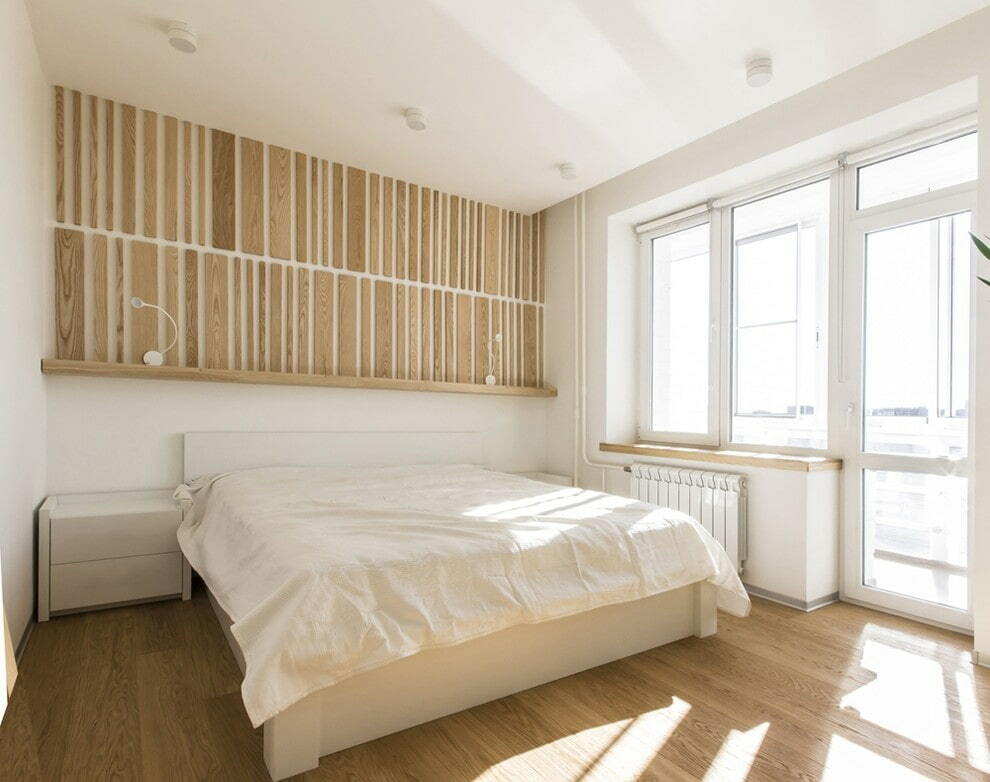 Dormitorio minimalista con persianas enrollables