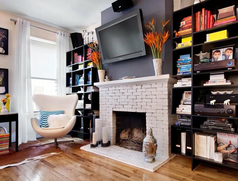 Decorative fireplace in a cozy studio apartment