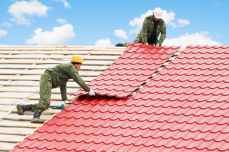 Roof covering with flexible sheet tiles