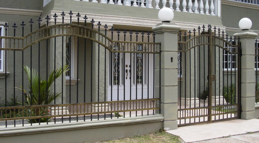Wrought iron gate in front of a country house