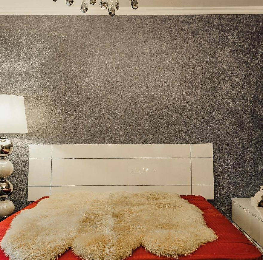 The combination of white furniture and gray walls