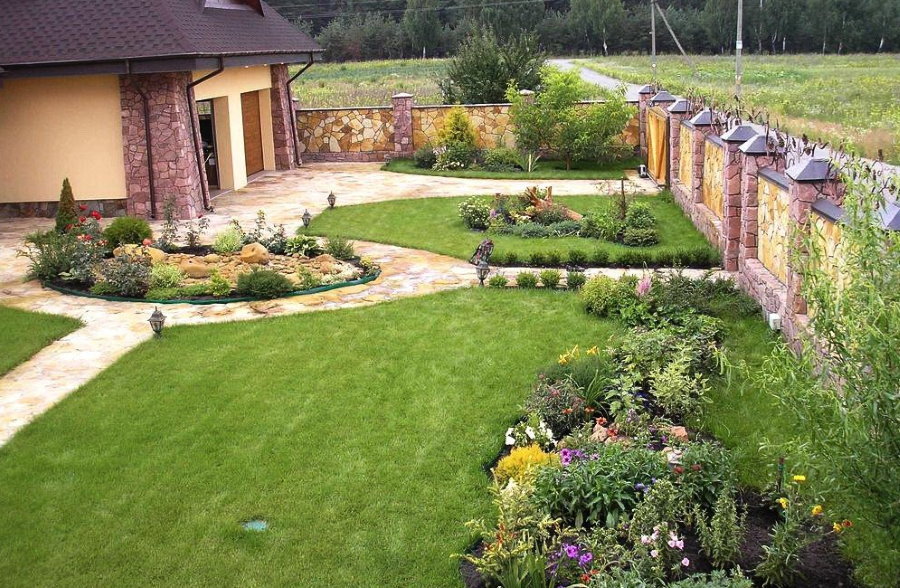 Lawns in the garden area with stone walls
