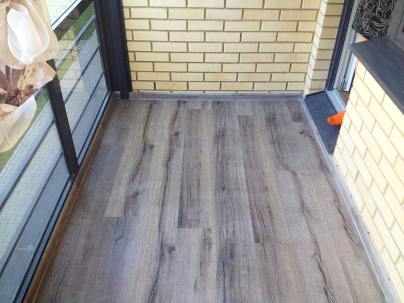 Laminate is not the best solution for a glazed, but not insulated balcony